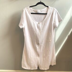 Woman’s white swim suit cover up